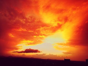 Low angle view of dramatic sky during sunset