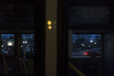 City street at night seen through window