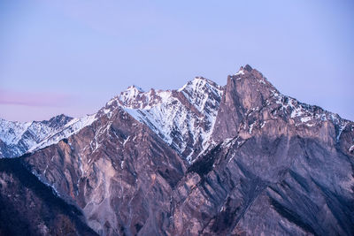 Scenic view of snow covered mountains