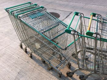 High angle view of shopping carts on footpath