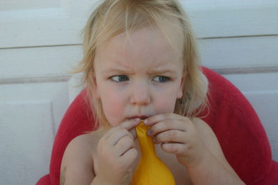 Portrait of cute girl eating food