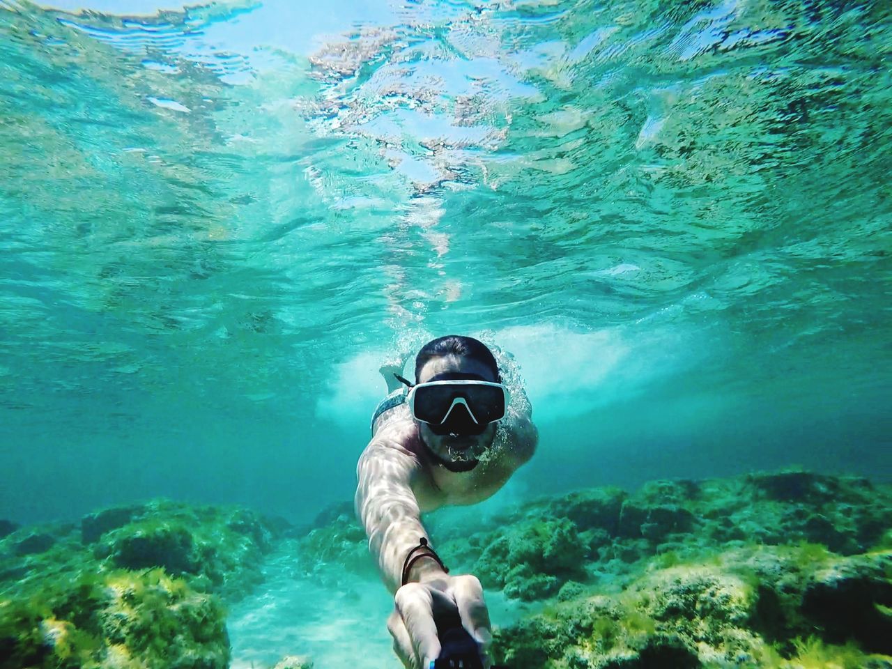 sea, water, underwater, swimming, undersea, one person, nature, real people, adventure, leisure activity, eyewear, portrait, lifestyles, exploration, snorkeling, day, aquatic sport, swimming goggles, outdoors, turquoise colored, underwater diving