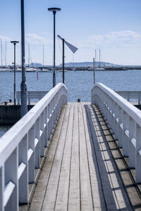 Pier over sea against sky