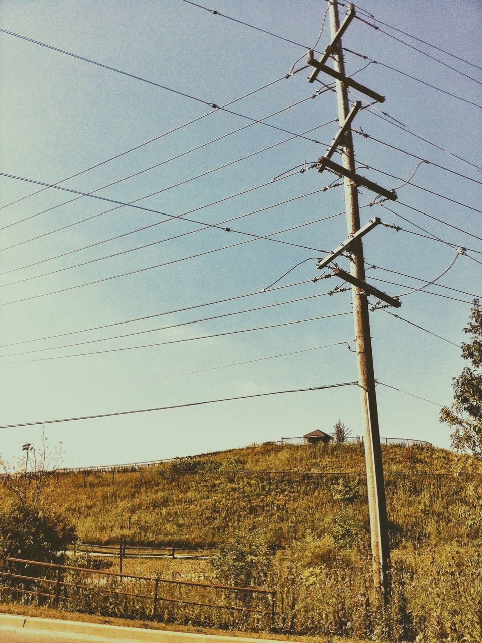 power line, electricity pylon, field, electricity, landscape, power supply, fuel and power generation, rural scene, cable, sky, connection, agriculture, technology, tranquility, tranquil scene, farm, clear sky, nature, blue, fence