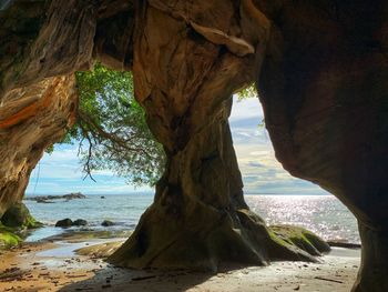 Scenic view of sea seen through rock formation