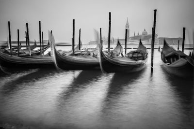 Boats moored in water