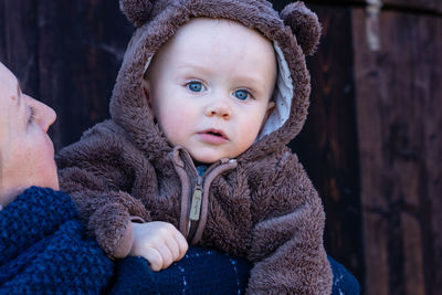 Portrait of a baby boy. woman holding baby in her hands. mother and son .