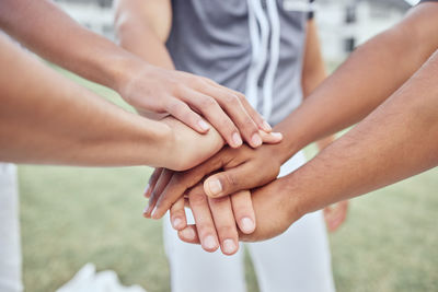 Midsection of couple holding hands