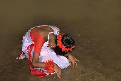 High angle view of girl with umbrella