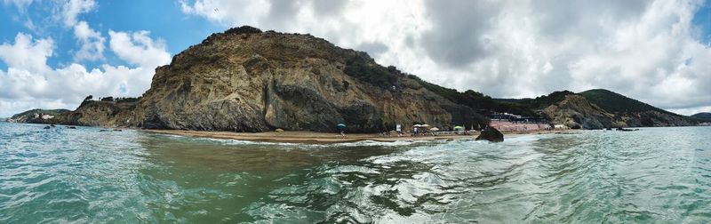 Panoramic view of sea and rocks against sky