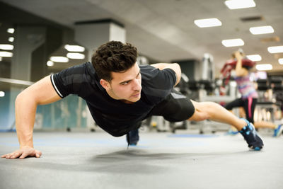 Man exercising in gym