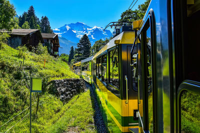 Train on railroad track against sky