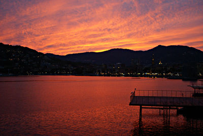 Scenic view of sea against orange sky