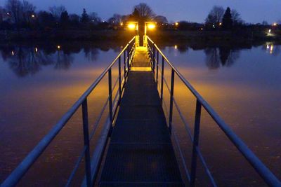 View of suspension bridge during winter at night