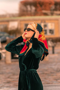 Portrait of young woman standing outdoors - vintage