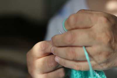 Close-up of person holding hands