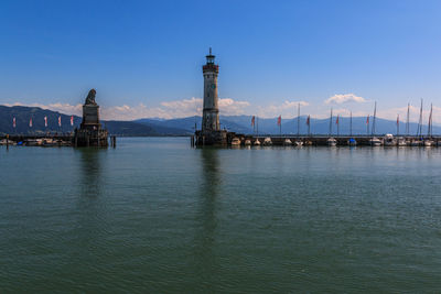 Scenic view of sea and buildings against sky