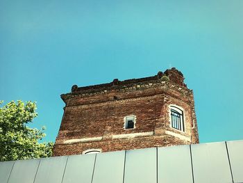 Low angle view of built structure against blue sky