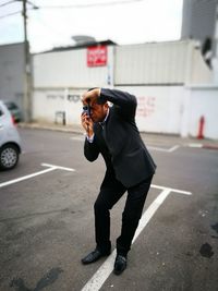 Full length of a man standing on street