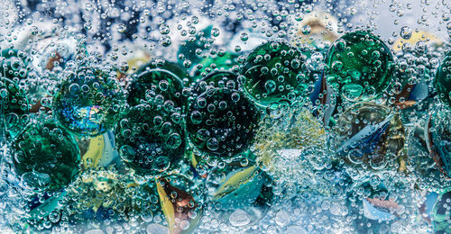 Glass balls in mineral water with bubbles