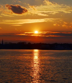 Scenic view of sea against romantic sky at sunset