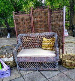 Chairs in basket against trees