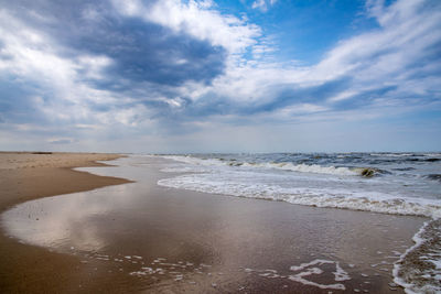 Scenic view of beach against sky