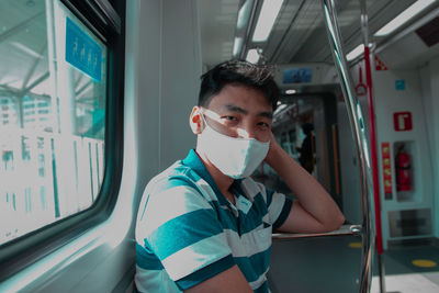 Rear view of boy in train