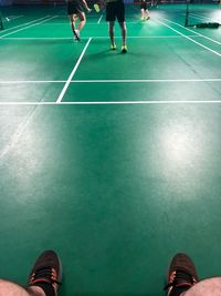 Low section of people standing on floor