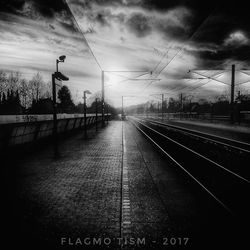 Railroad tracks against sky during sunset