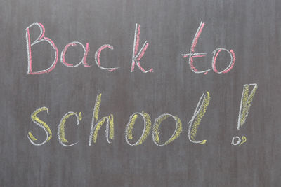 Close-up of text on black sign