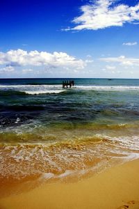 Scenic view of sea against cloudy sky