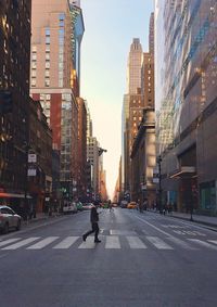 City street amidst buildings against sky