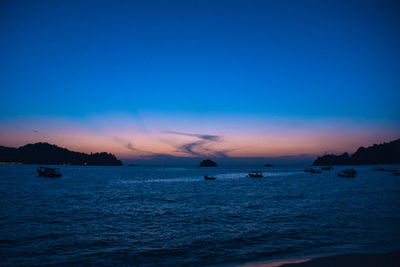 Scenic view of sea against sky at sunset