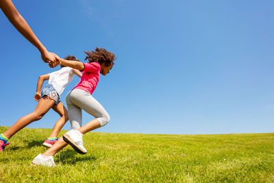 Full length of woman on field against clear sky