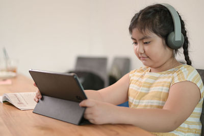 Young woman using laptop at home