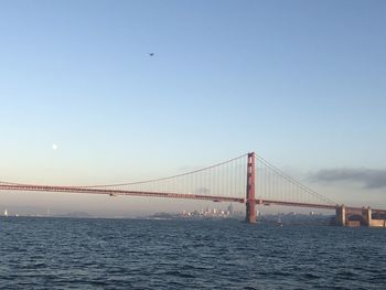 View of suspension bridge over sea