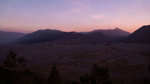 Scenic view of mountains against sky during sunset