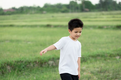 Boy standing on field