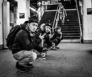 High angle view of friends on staircase in city