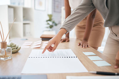 Midsection of man working in office