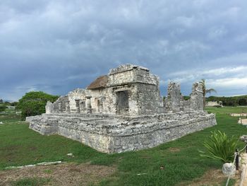 Scenic view of landscape against cloudy sky