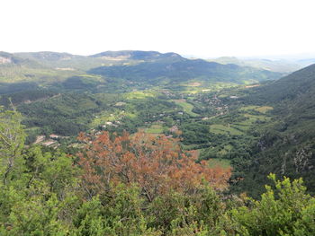 High angle view of trees and mountains against sky