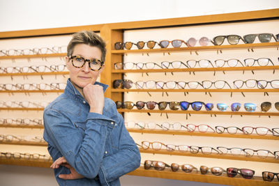 Portrait of smiling woman standing in store