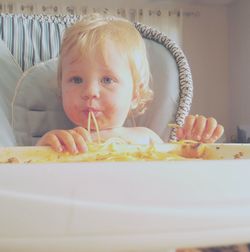 Close-up portrait of cute baby at home