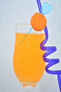 Close-up of orange juice against white background