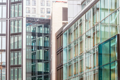 Full frame shot of modern glass building in city