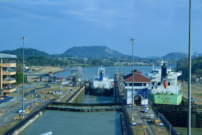 High angle view of harbor by sea against sky