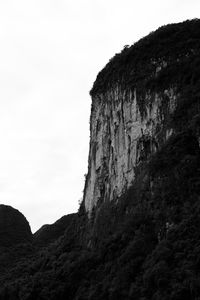 Low angle view of rock formations against sky