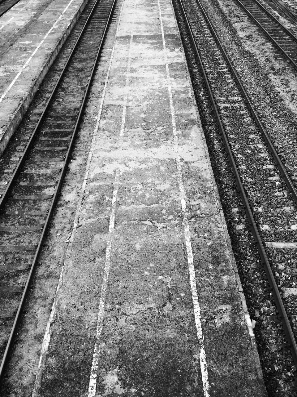 HIGH ANGLE VIEW OF RAILROAD TRACKS AT STATION